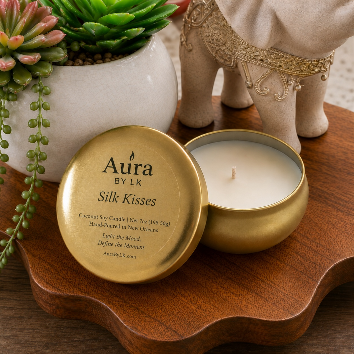 Aura BY LK Silk Kisses candle in gold tin.